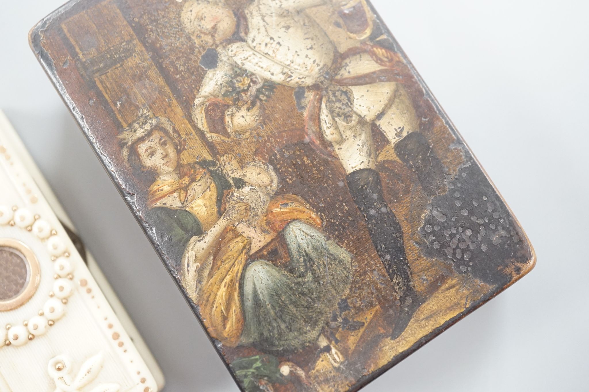 A 19th century papier mache snuff box and a similar carved ivory toothpick box, snuff box 5 cms wide x 8 cms high.